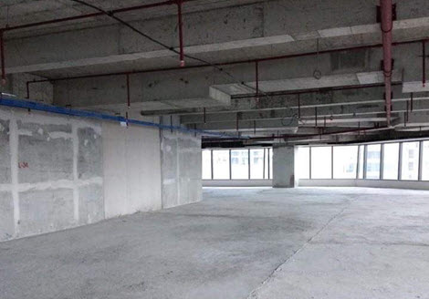 Elcad's site inspection process showing an office space with construction tools and plans.