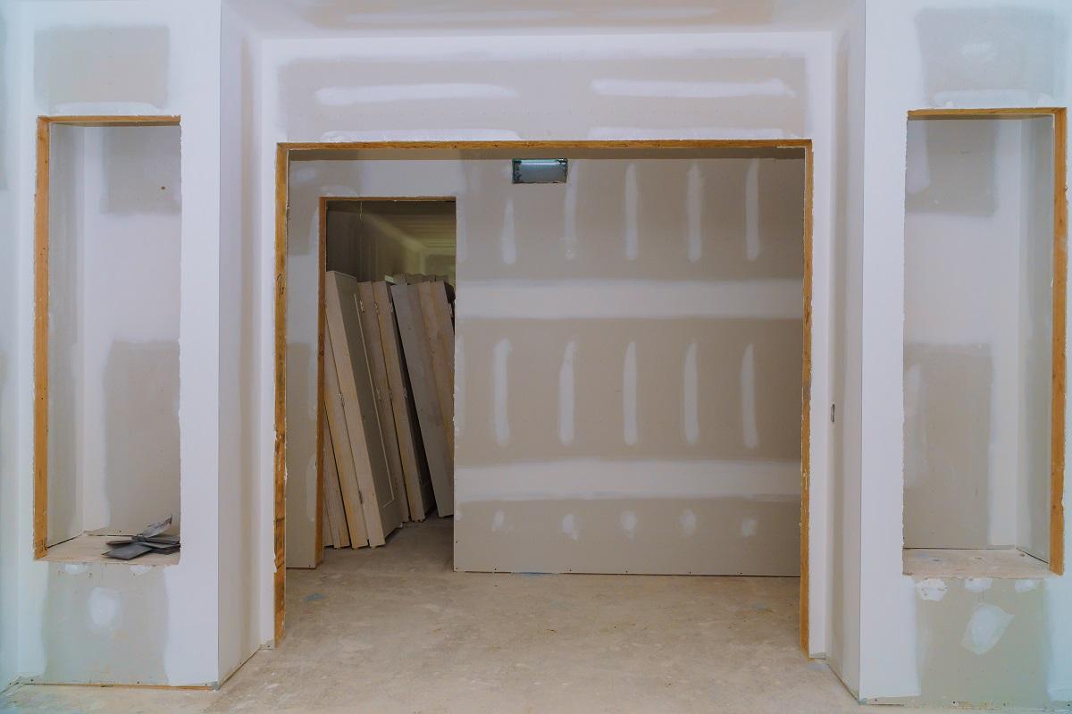 Interior construction of housing project with door and molding installed
