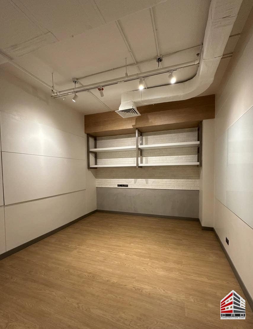 Built-in office shelves and feature wall